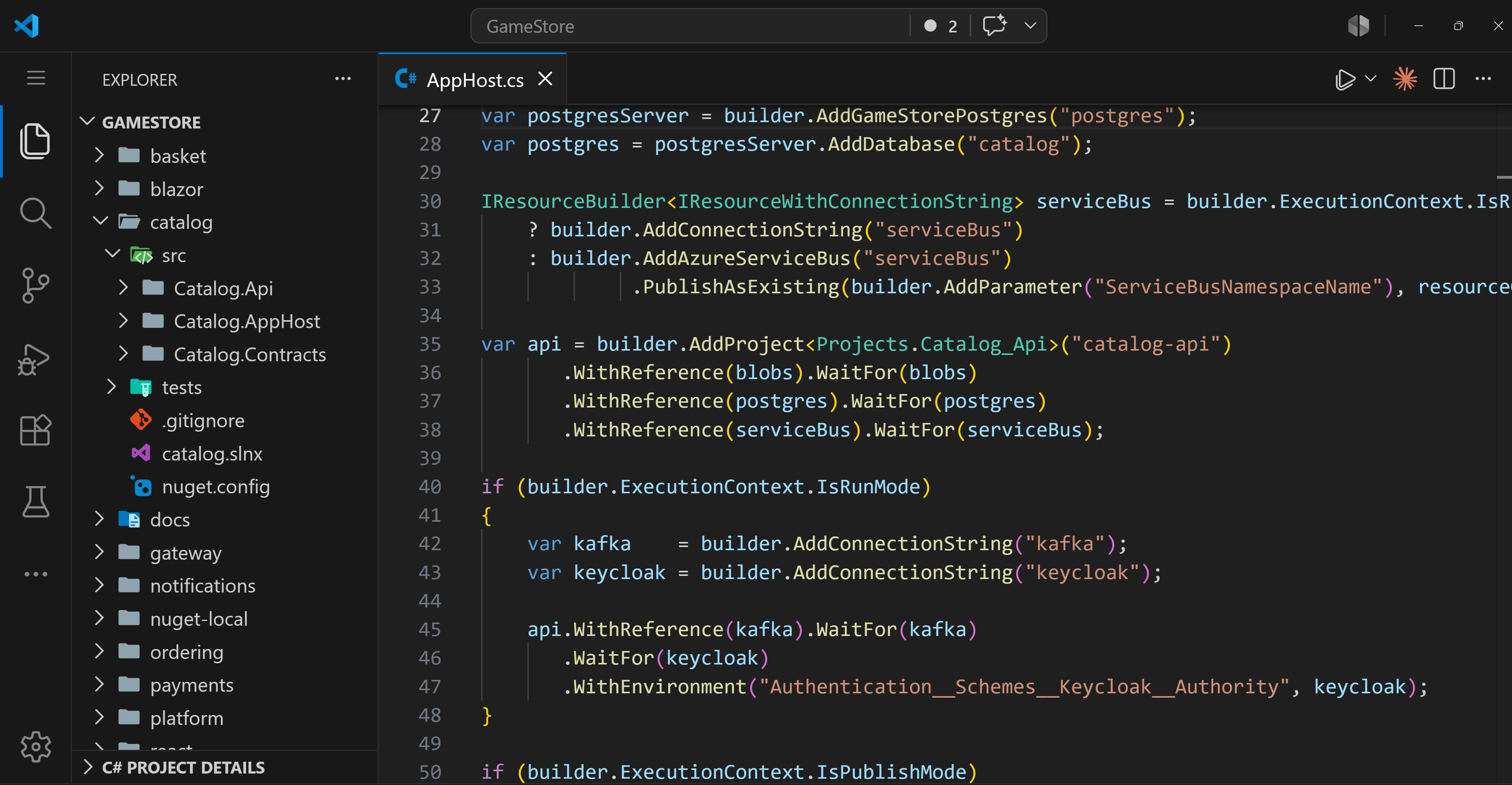 The Game Store Microservices solution open in VS Code: the Explorer shows each service as its own repo (basket, catalog, gateway, notifications, ordering, payments, platform), and the Catalog AppHost.cs defines the service in C# with AddProject, WithReference, and WaitFor calls wiring in PostgreSQL, blob storage, Service Bus, Kafka, and Keycloak.